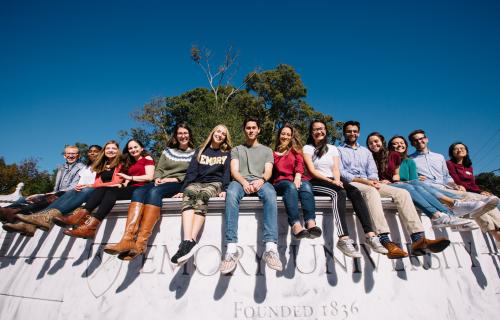 students on wall